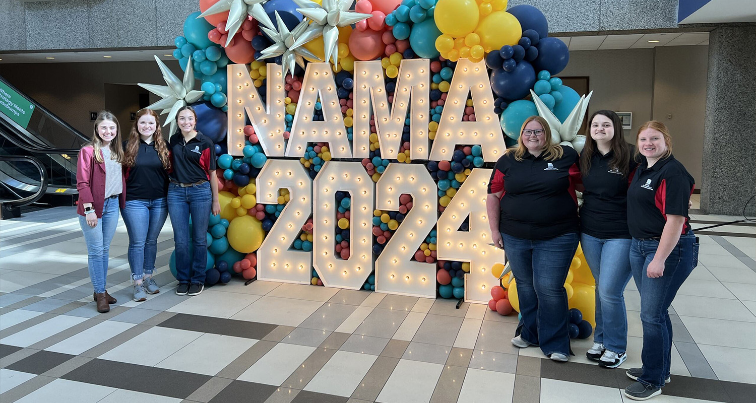 Six students from the National Agri-Marketing Association pose at a NAMA conference