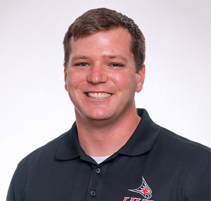 Headshot of Brandt Berghuis, a man wearing a black UWRF polo shirt