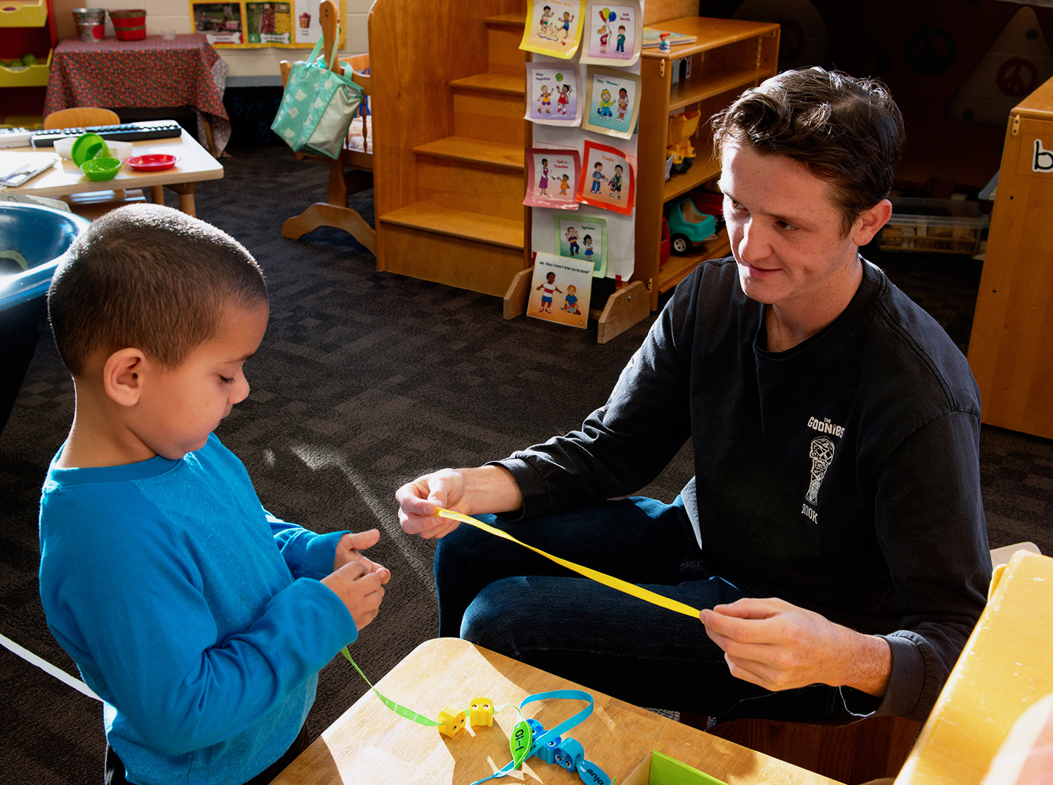 Student teacher helps a student during class time