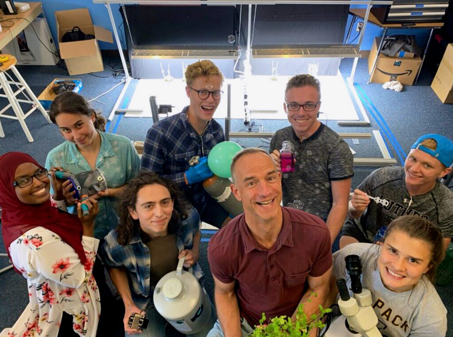 A group of students pose for the camera at a Science Lab event