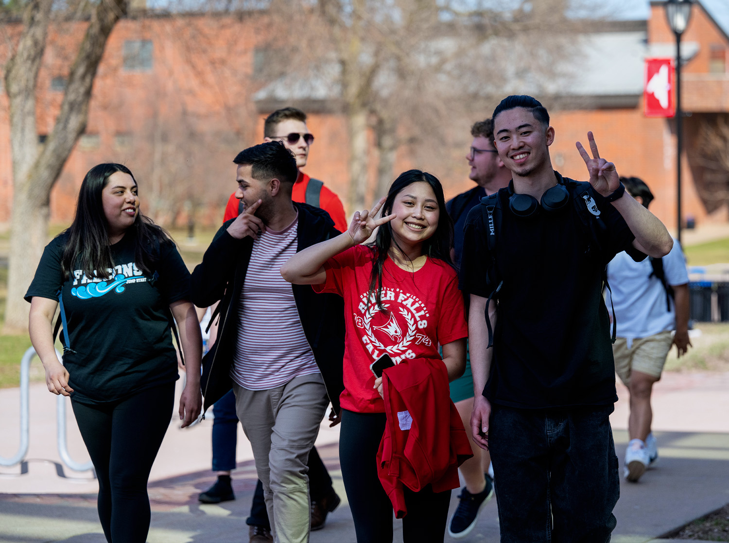 A group of first-year students walk into the University Center