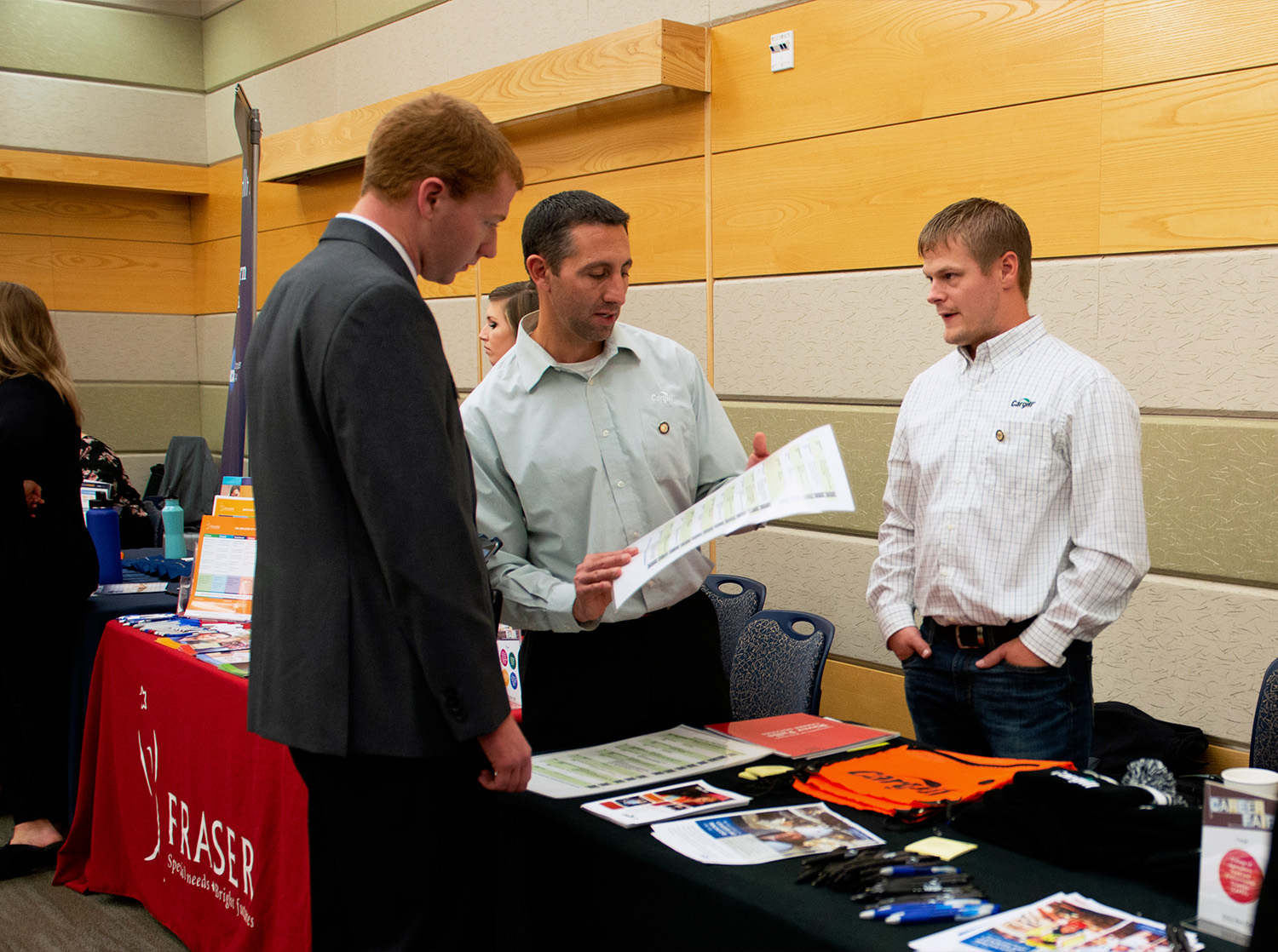 A male student speaks to an employer during the UWRF career fair.