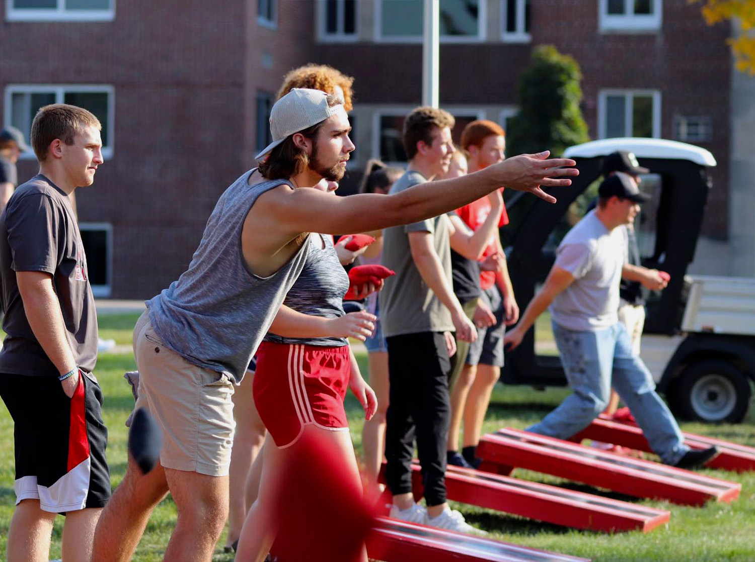 Students participate in a bag toss tournament