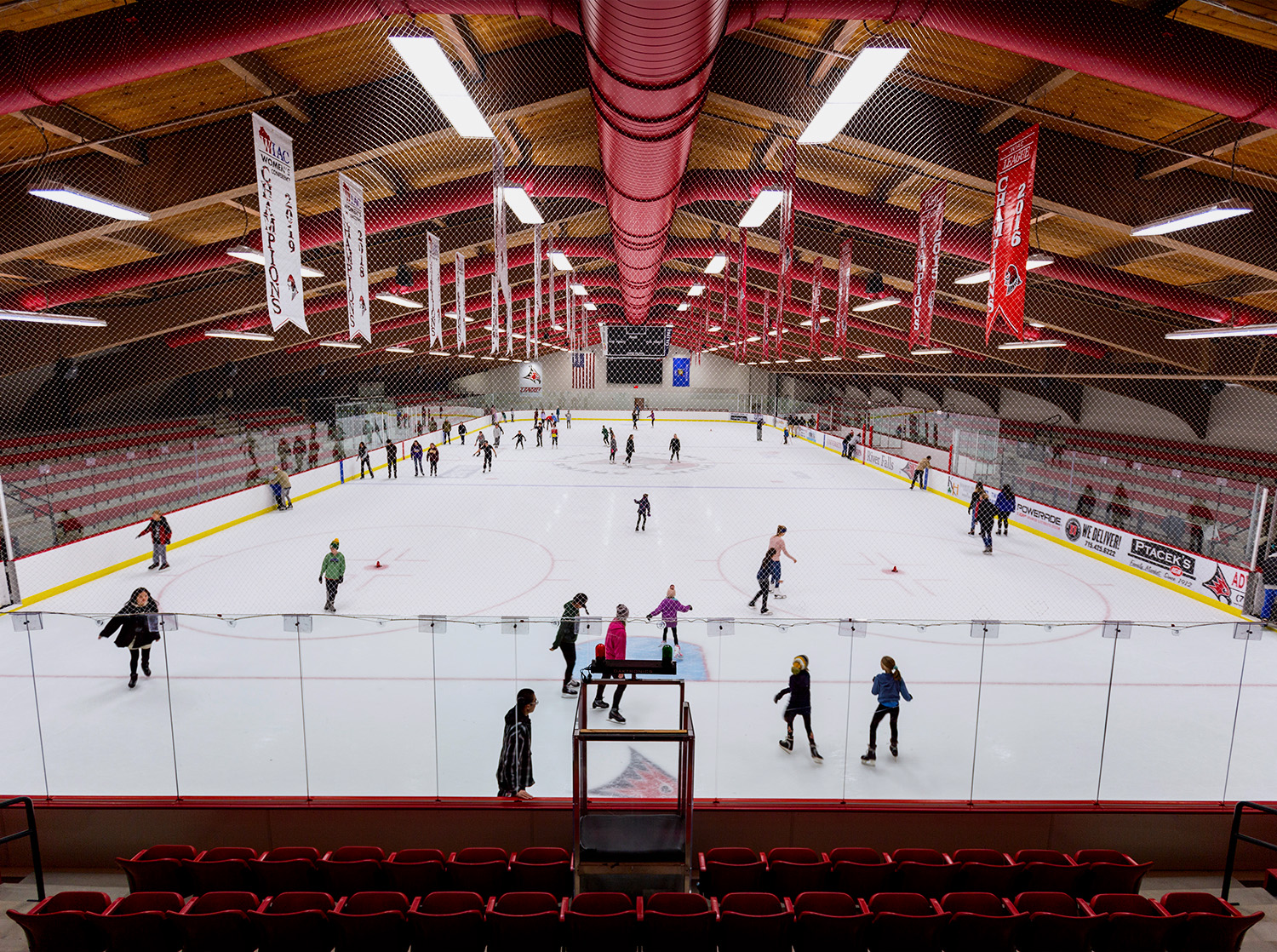 A group of people enjoy an open skate session in Hunt Arena