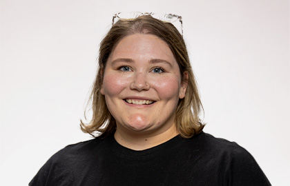 Headshot of Courtney Brommer, a young woman with short blond hair and a black tshirt