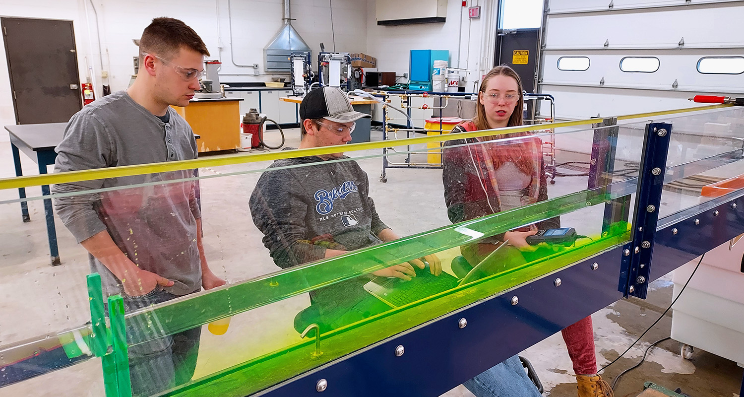 Students in the ENVN 280 class use a flume to test water samples