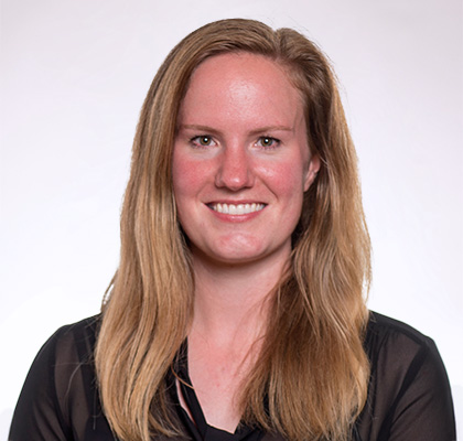 Headshot of Kelsey Cowart, a woman with long blonde hair wearing a black blouse