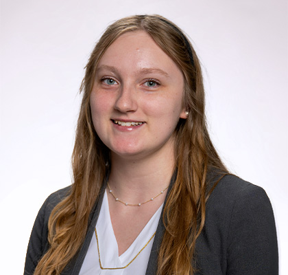 Headshot of Lauren Neff, a female student with long light brown hair wearing a white blouse and light gray blazer