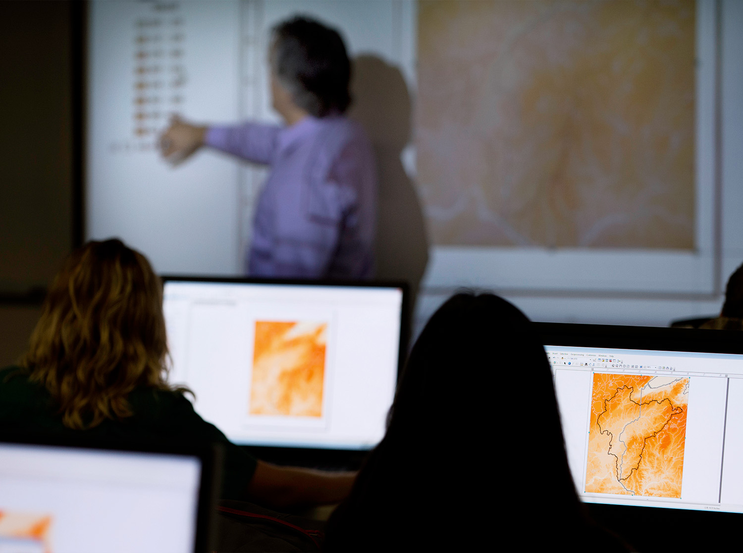 Rows of computer screens in the GIS lab