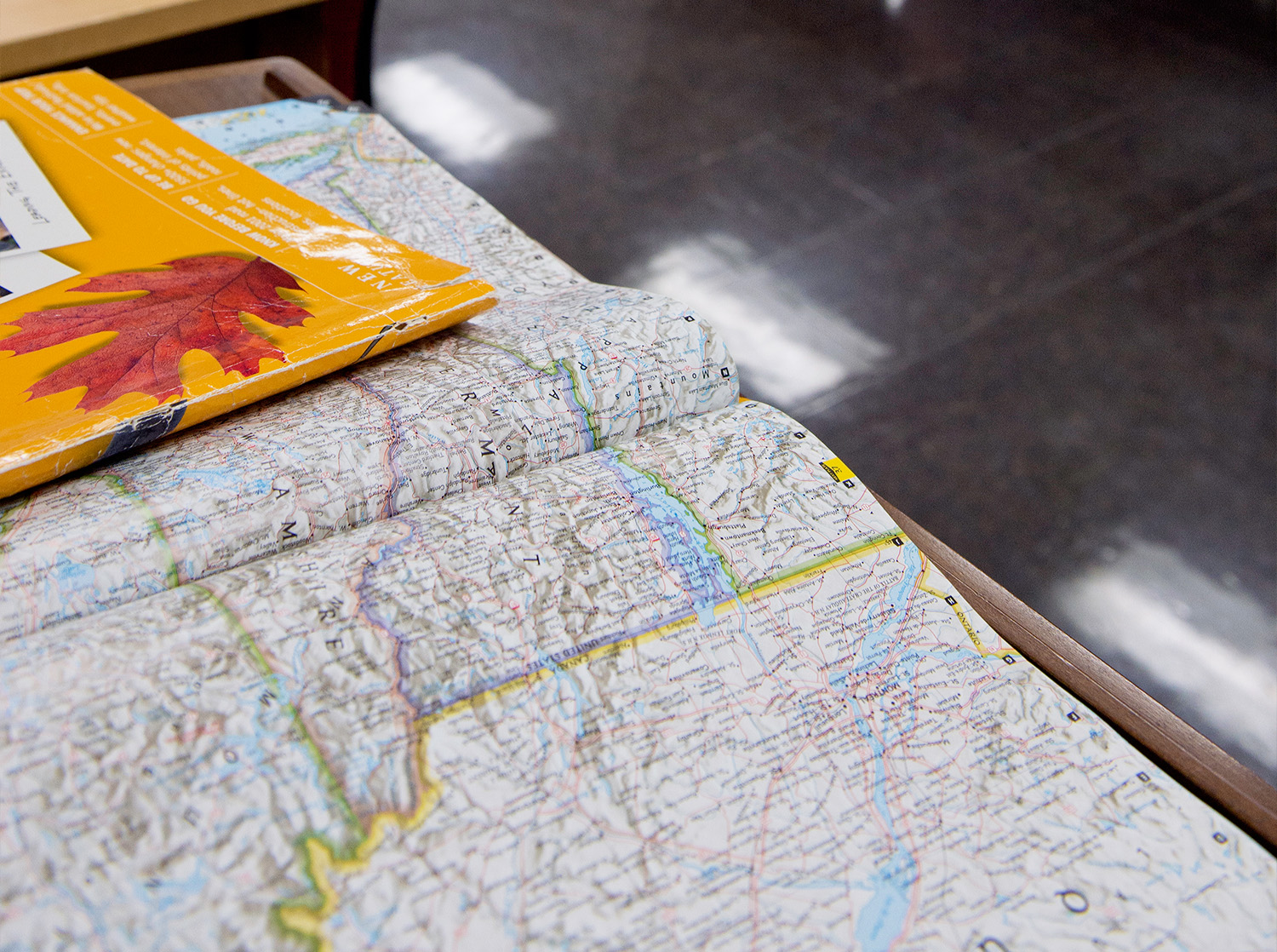 A map is laid out on a table