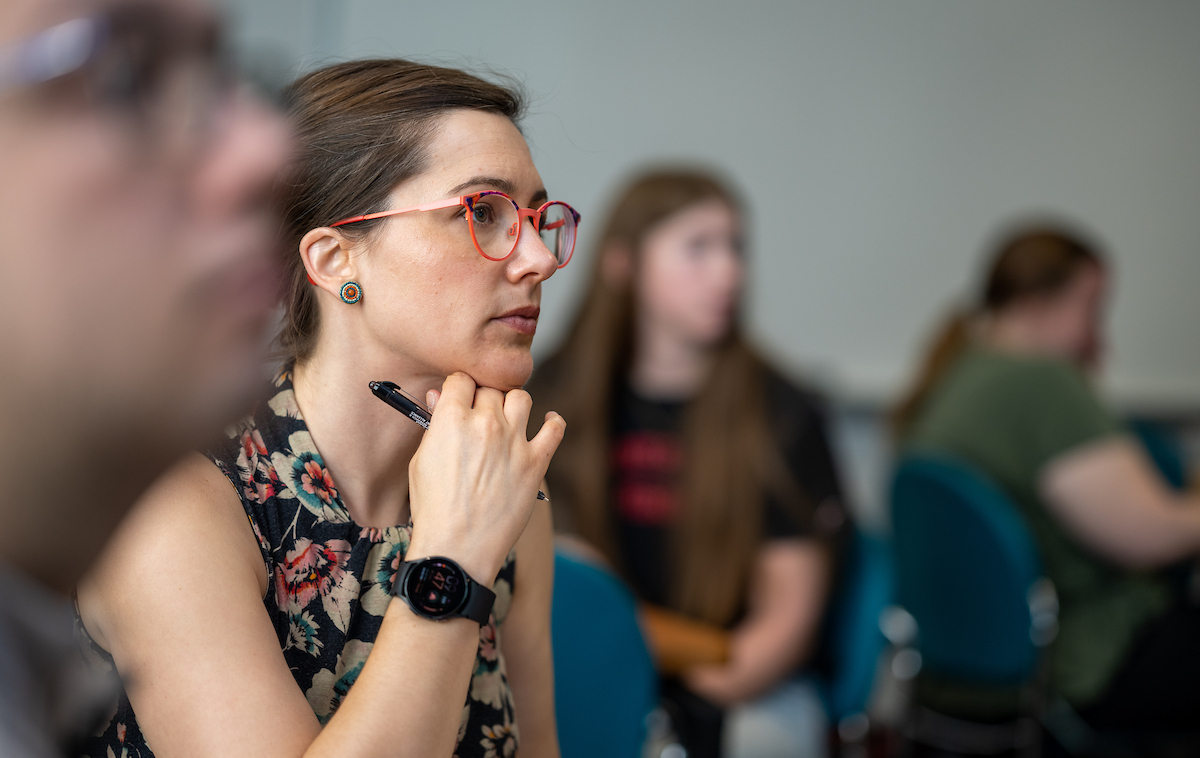 a female student listens to a lecture