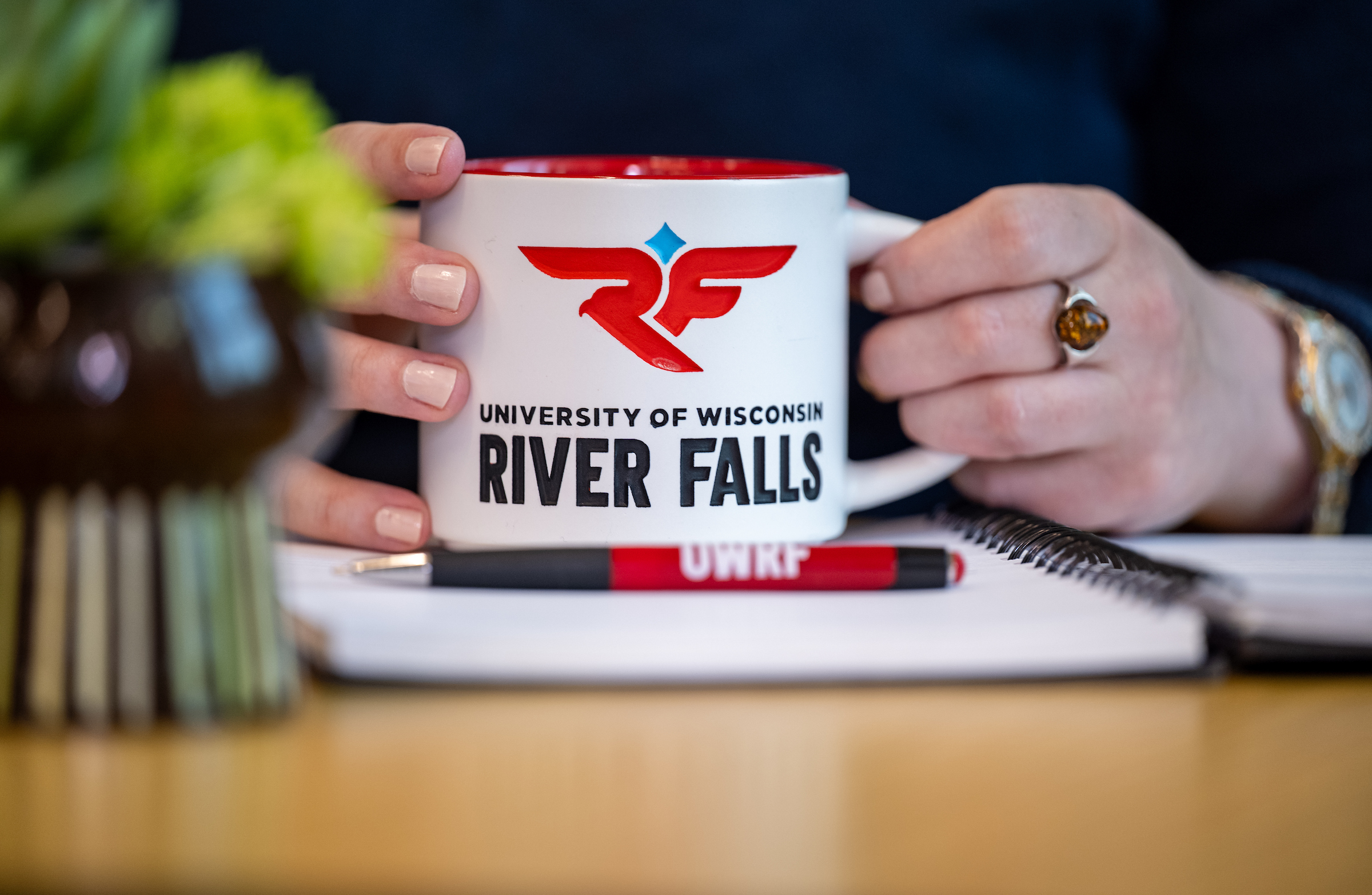 a photo of a coffee mug with the UWRF logo on it