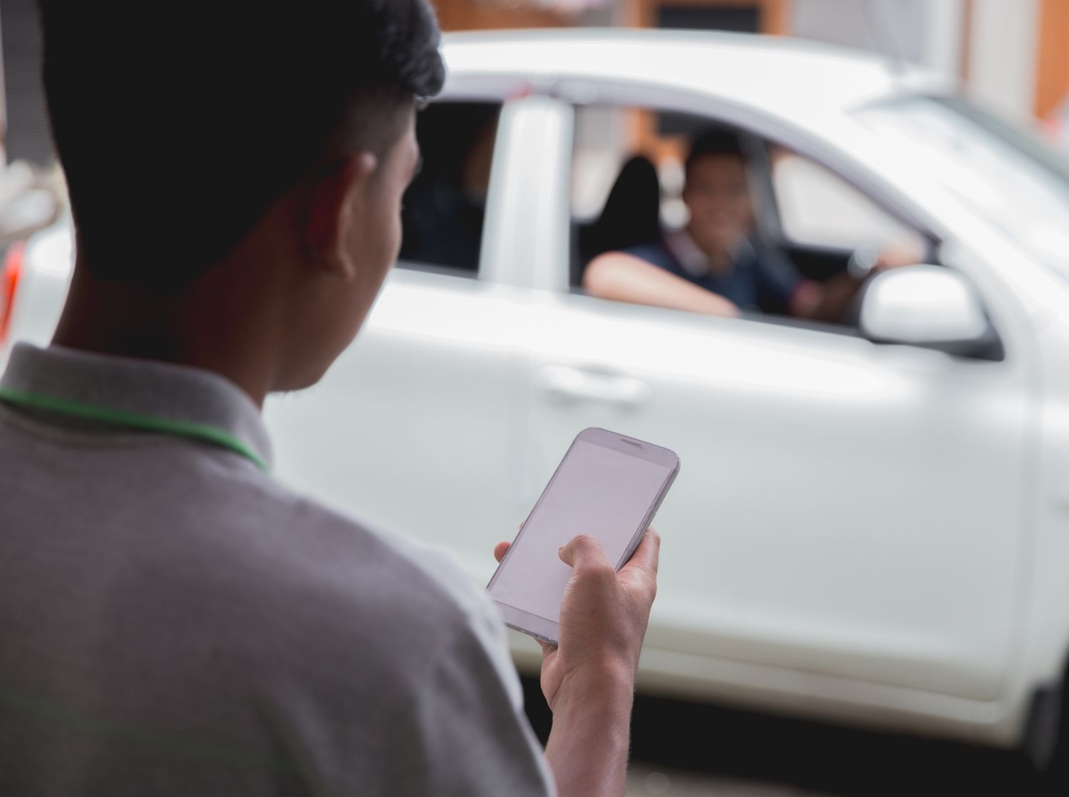 An individual using a rideshare app
