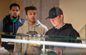 Students wait for food at Riverside Commons