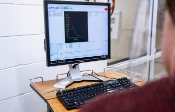 A person views a line graph on a computer