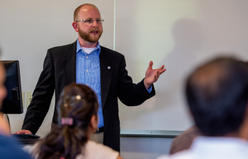 A professor speaks to a class