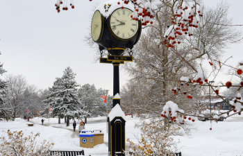 The campus clock during winter with several inches of snow