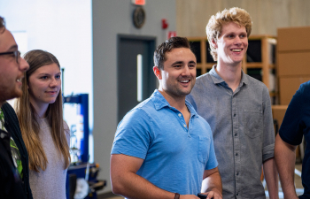 A group of interns listen to their supervisor.