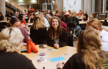 A group of students play bingo in the University Center