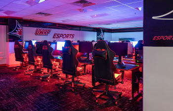 the esports arena with computers and gaming chairs