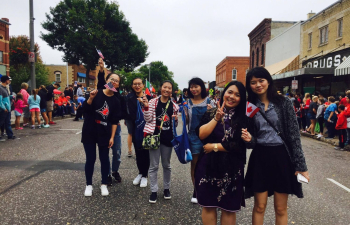 International students at homecoming parade