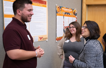 Chancellor Maria Gallo speaks to a student during the URSCA fall gala