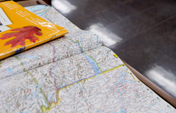 A map is laid out on a table