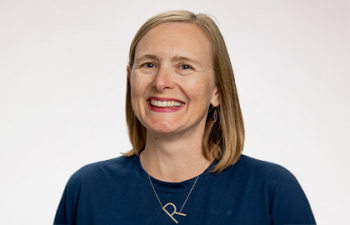 Headshot of Rachelle Haroldson, a women with blonde hair with a dark blue blouse