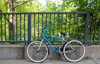 Bicycle leaning on a fence