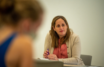 a faculty member listens
