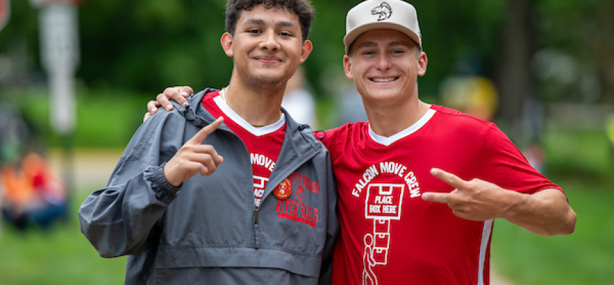 Two men posing on move in day